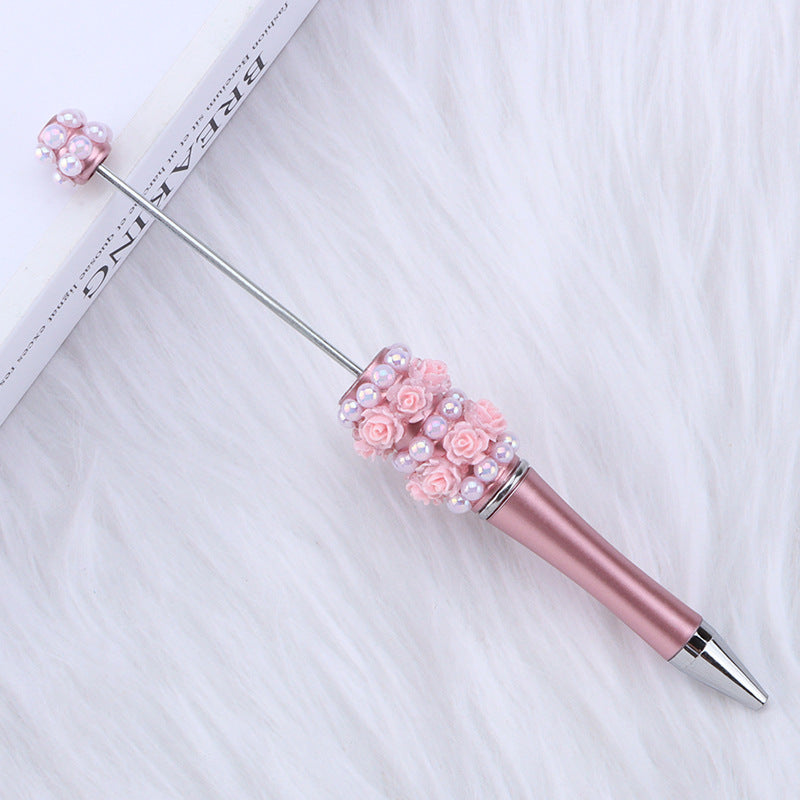 Cross-border rose pearl bead pen heavy industry DIY plastic pen, exquisite and creative handmade patch rotating gift pen